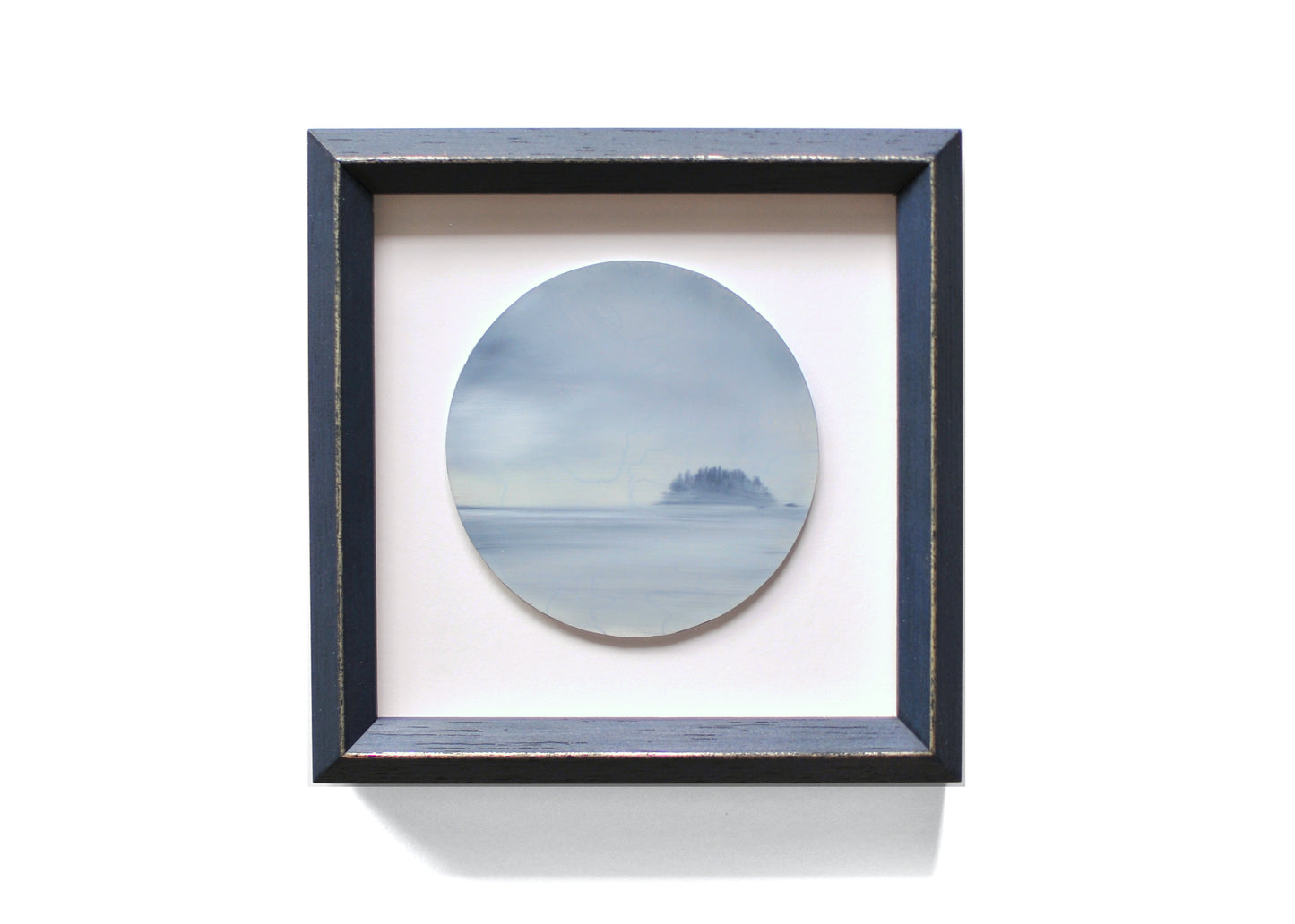 Small, framed oil painting of an island by Natasha van Netten