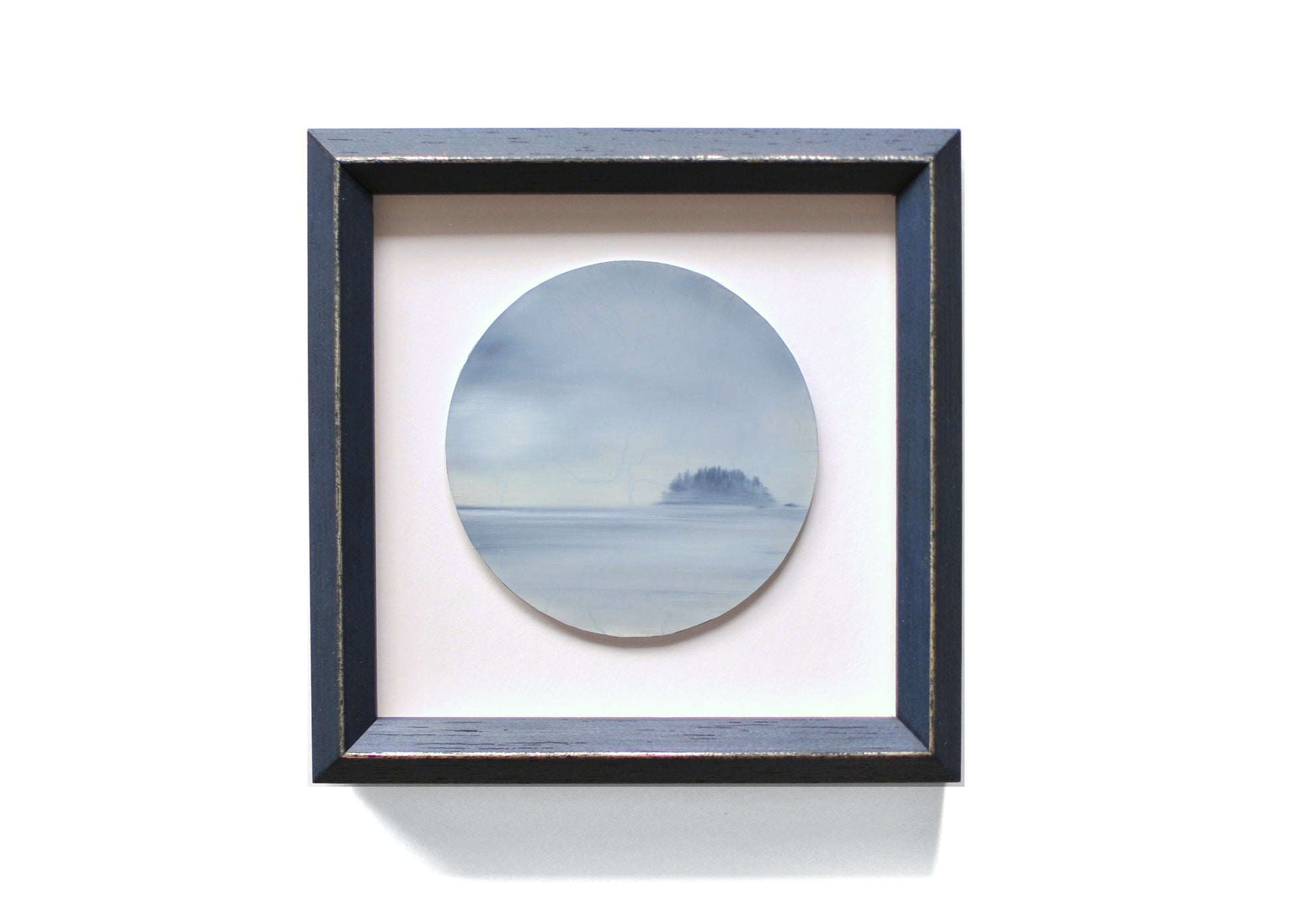 Small, framed oil painting of an island by Natasha van Netten
