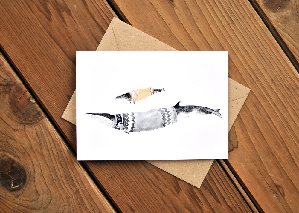 A Minke and Fin whales wearing Icelandic sweaters called lopapeysa.