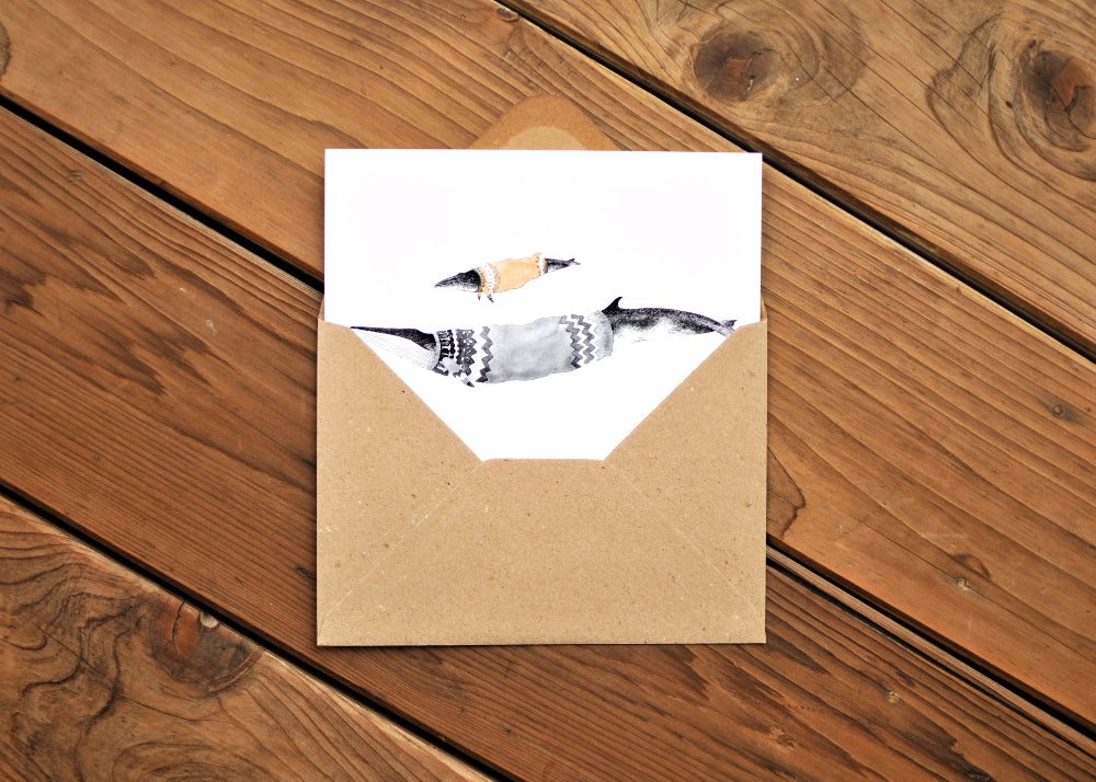 A Minke and Fin whales wearing Icelandic sweaters called lopapeysa.