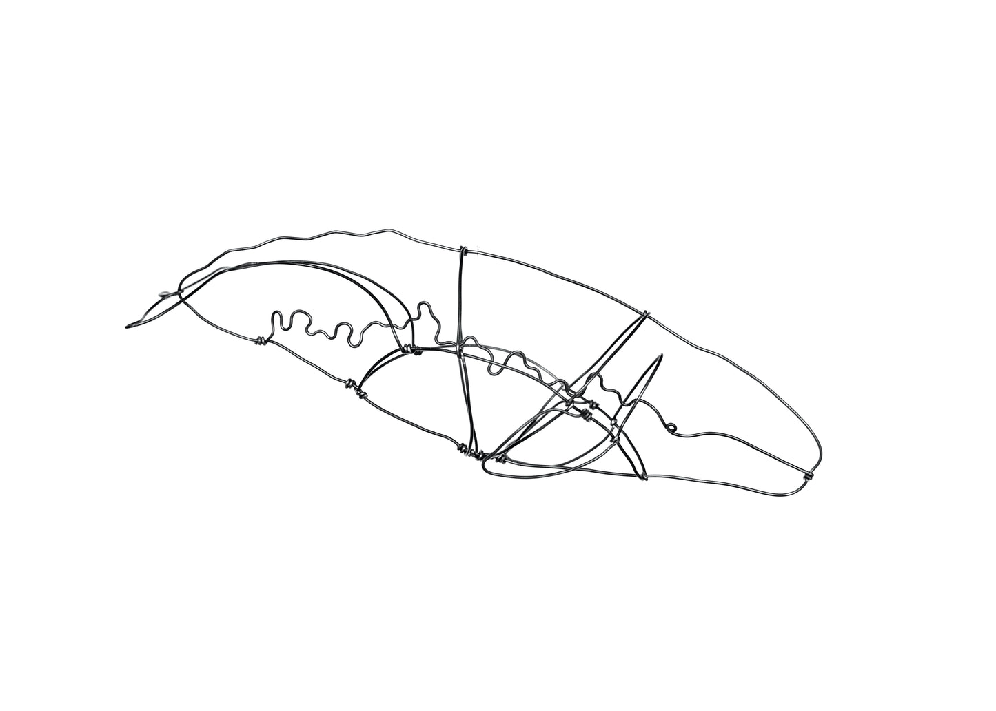 Photo of a wire grey whale sculpture.