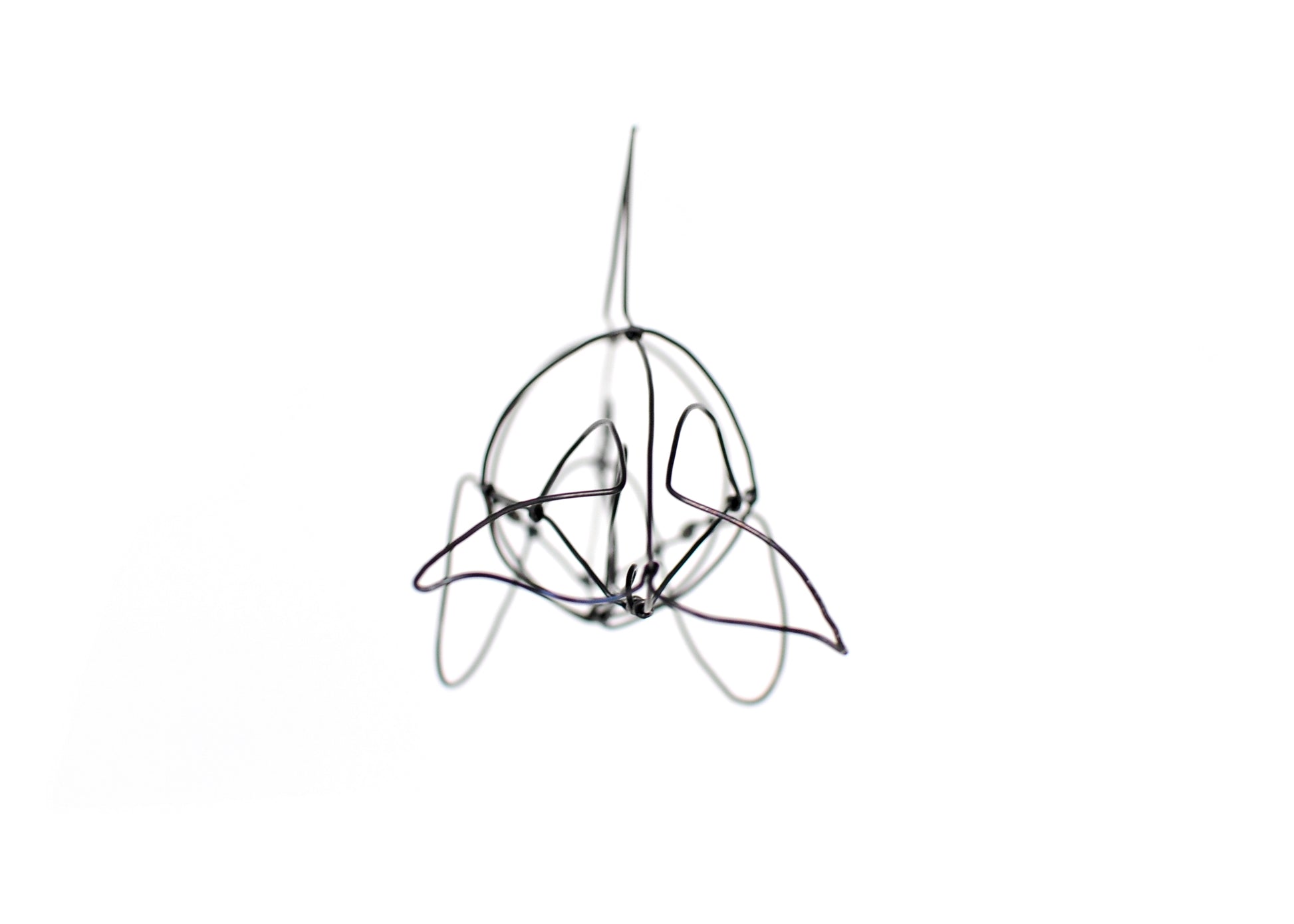 Photo of a 3D wire orca whale sculpture.
