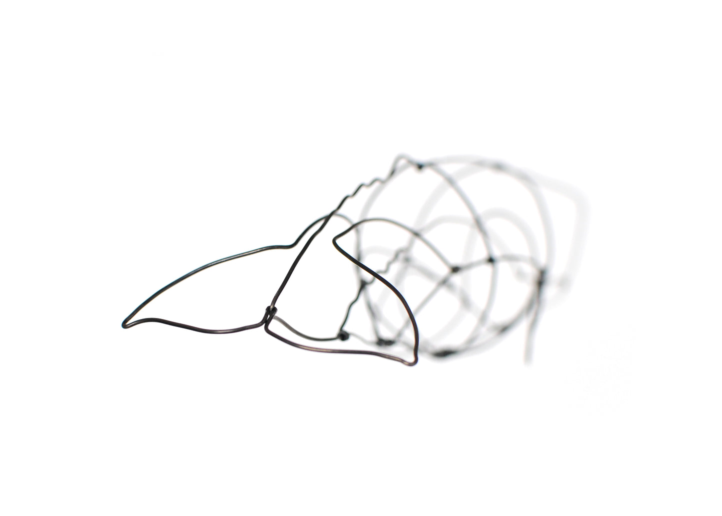 Photo of a 3D wire sperm whale sculpture.