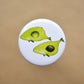 Pin back button with two imaginative "Avocado whales".