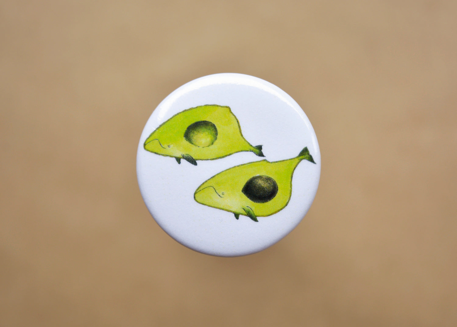 Pin back button with two imaginative "Avocado whales".