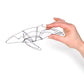 Photo of a 3D wire humpback whale sculpture held in hand.